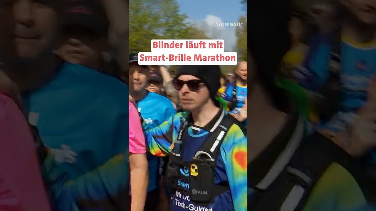 Blinder Läufer Clark trägt eine Smart-Brille mit Kamera beim Marathon und wird von Freiwilligen per App geführt