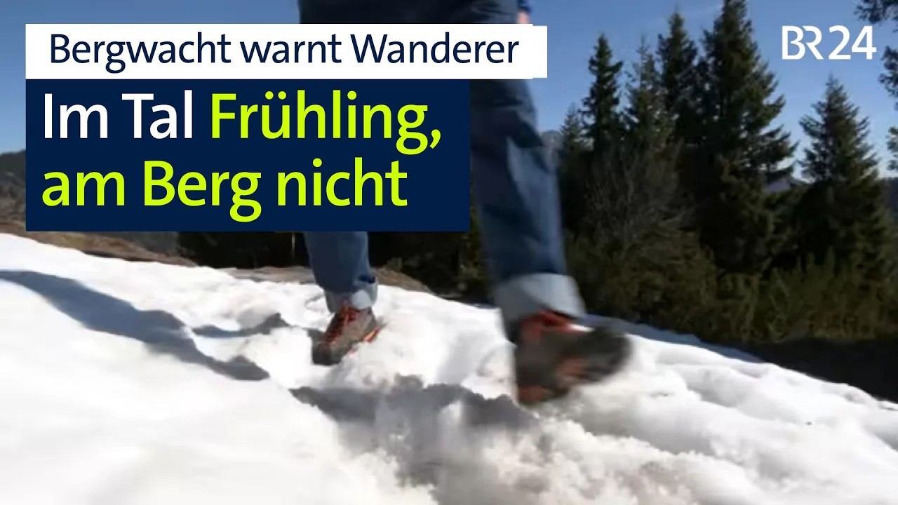 Bergwacht Frühling Gefahr – Bergwacht-Mitglied auf schneebedecktem Bergweg im Frühjahr – Frühlings-Gefahr im Gebirge