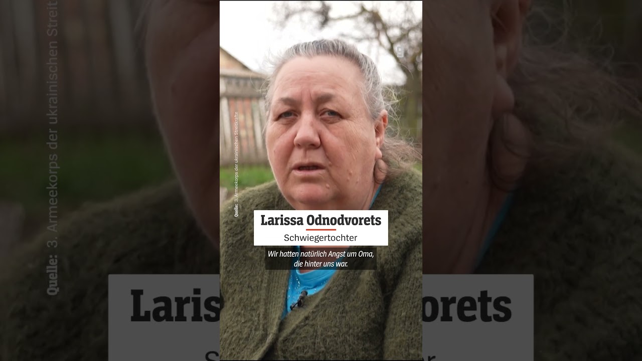 Eine ältere Frau sitzt auf einem unbemannten Militärfahrzeug bei der Roboter Evakuierung Ukraine nahe der Front in Donezk