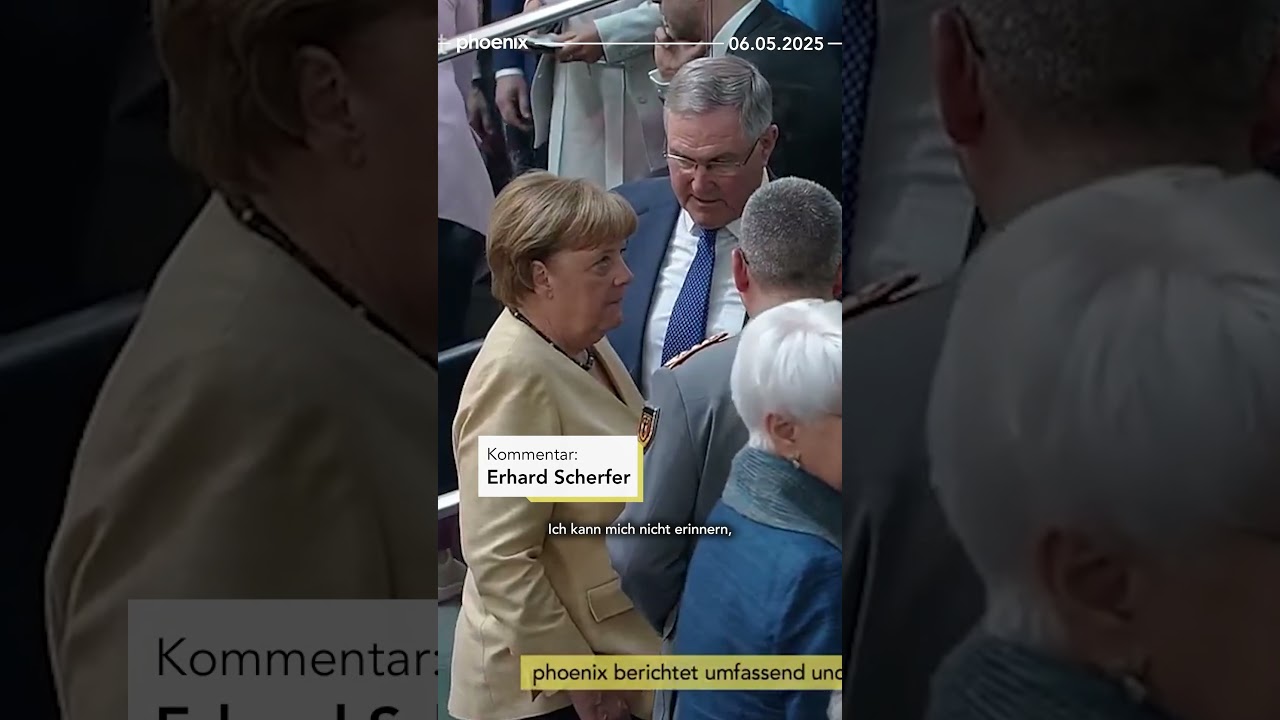 Merz Bundeskanzler – Friedrich Merz steht nach seiner Wahl zum Bundeskanzler im Bundestag, umgeben von Abgeordneten