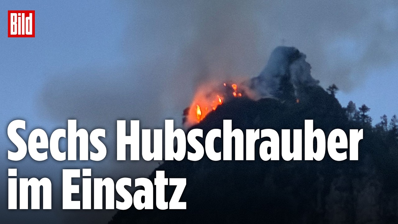 Dichter Rauch steigt beim Waldbrand Ruhpolding am Saurusselkopf auf, Hubschrauber im Löscheinsatz