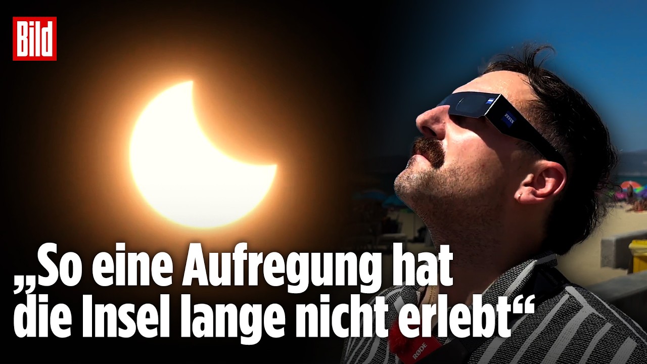 Sonnenfinsternis Mallorca – Tausende Menschen mit Schutzbrillen beobachten die Sonnenfinsternis auf Mallorca an der Playa de…