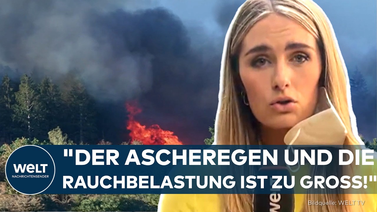 Löschhubschrauber wirft Wasser über brennendem Waldgebiet in der Eifel – Waldbrand Eifel mit Rauchsäulen über dem Landkreis …