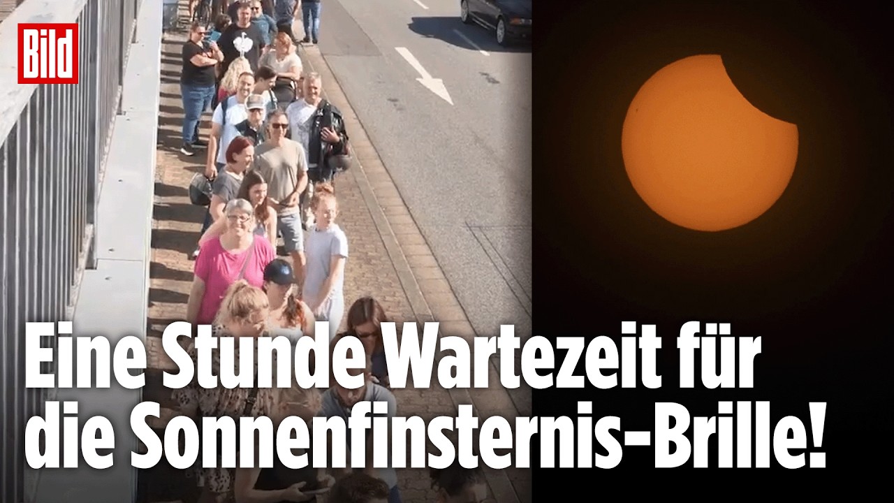 Sonnenfinsternis Schutzbrille – Lange Warteschlange von Menschen, die auf eine Sonnenfinsternis-Schutzbrille warten, in eine…