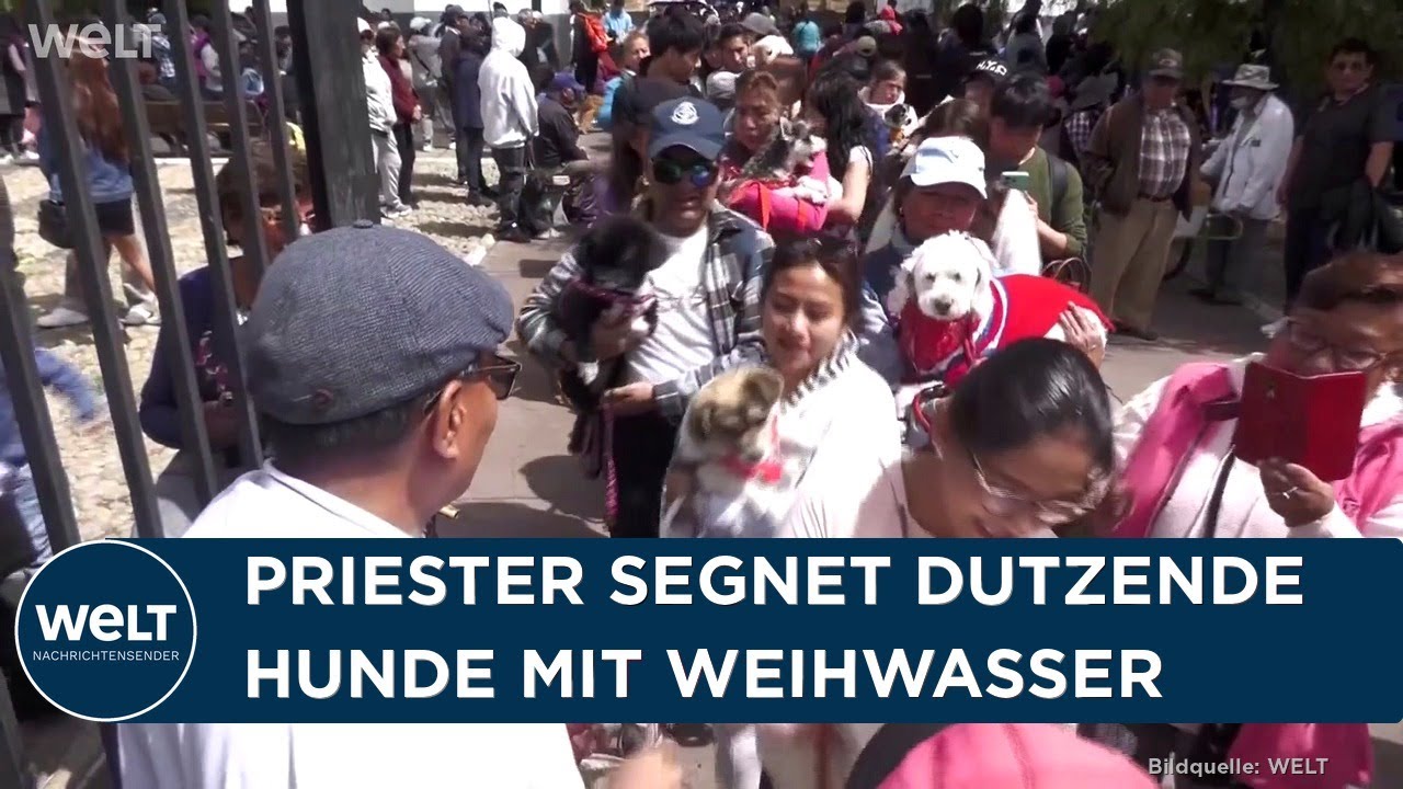 Rochus-Tag Bolivien – Gläubige halten ihre Hunde zur Segnung am Rochus-Tag vor der Kirche San Pedro in La Paz, Bolivien