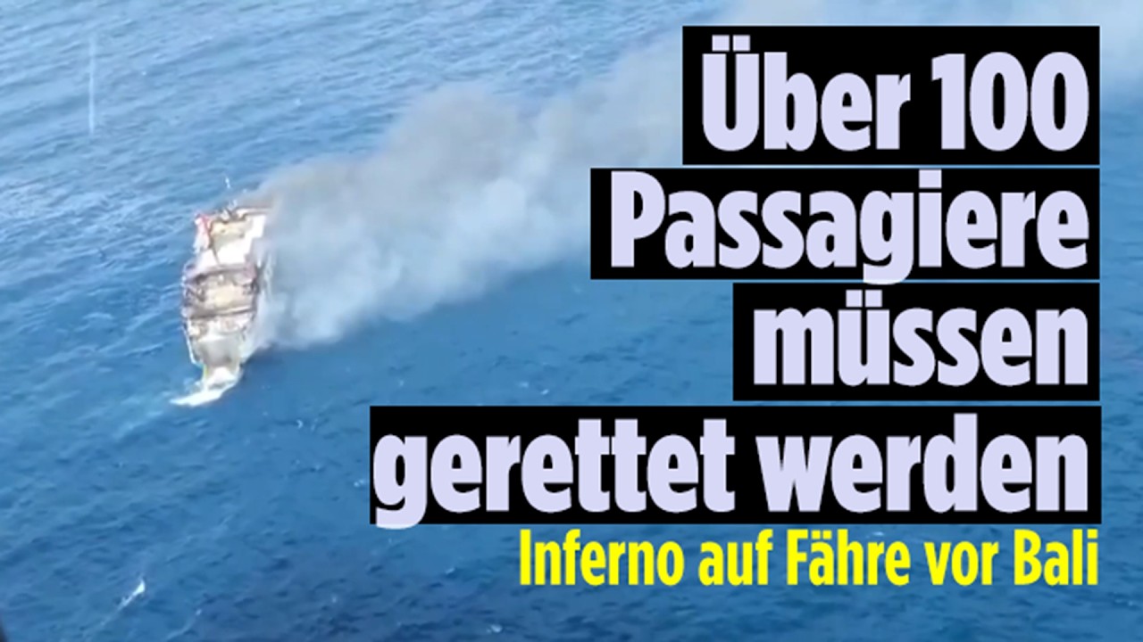Brennende Fähre vor der Küste Balis mit Rettungsbooten voller Passagiere – Fähre vor Bali in Flammen