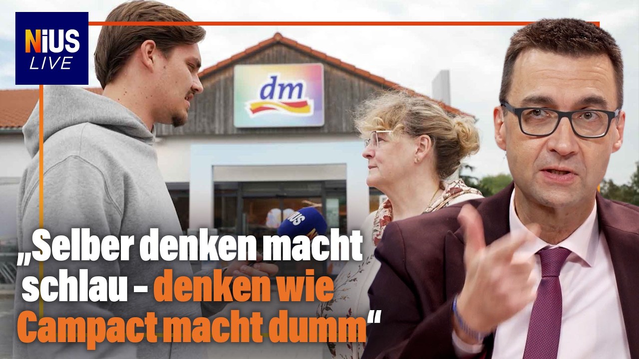 Protestschild vor einer DM-Filiale beim Edeka-Boykottaufruf gegen freie Medien in Deutschland