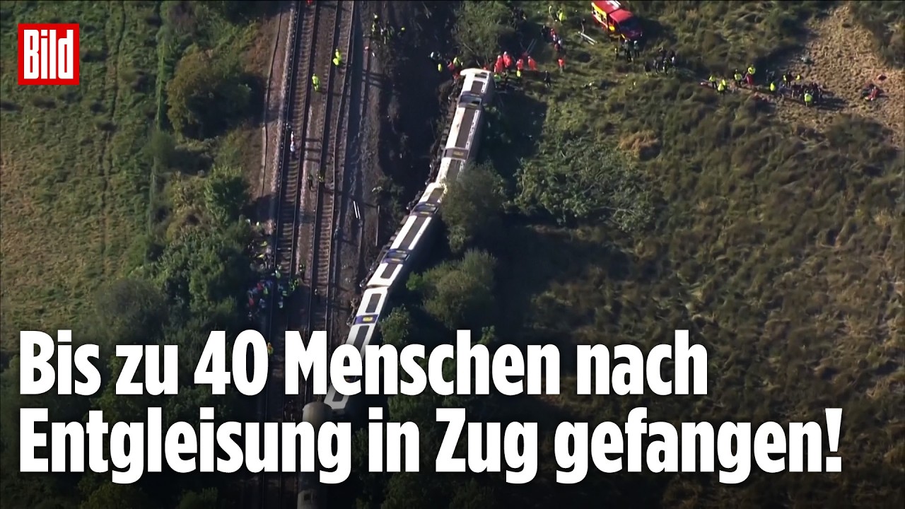 Zugunglück England – Entgleister Zug in England mit Einsatzkräften am Unfallort – Zugunglück mit eingeschlossenen Passagieren