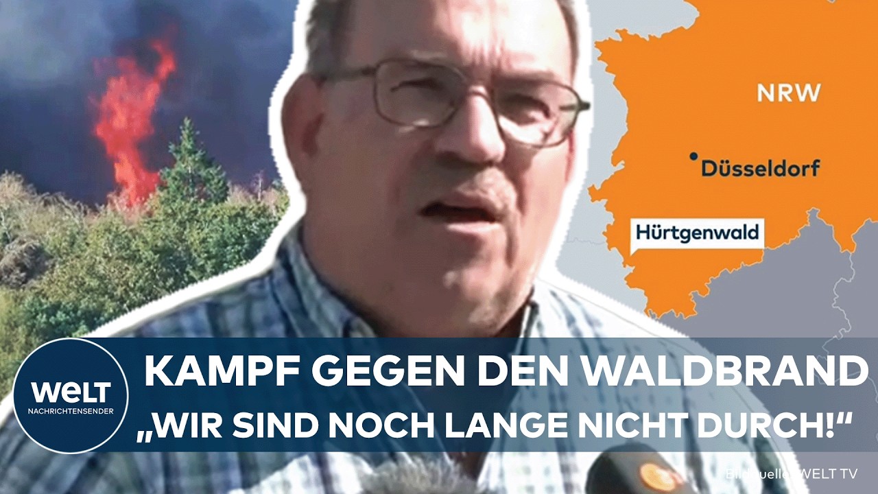 Löschhubschrauber über dem brennenden Hürtgenwald, dichter Rauch steigt auf – Waldbrand Hürtgenwald im August 2026