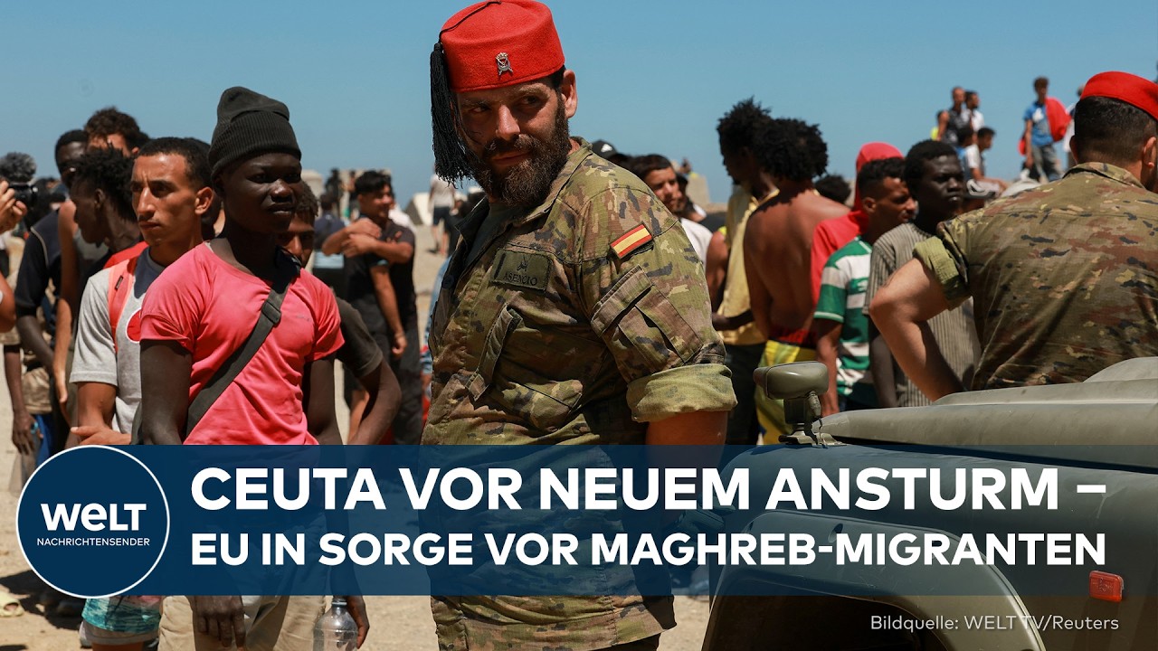 Migranten-Ansturm Ceuta – Migranten an der Grenzbefestigung von Ceuta versuchen den Zaun zur spanischen Exklave zu überwinden