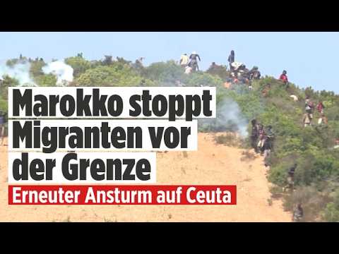 Ceuta Migranten – Marokkanische Sicherheitskräfte mit Einsatzfahrzeugen stoppen Ceuta-Migranten nahe der spanischen Grenze