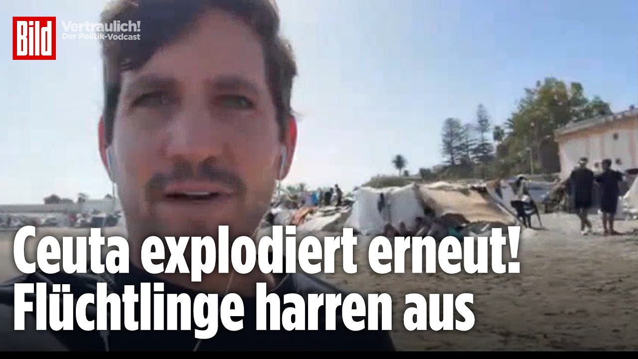 Flüchtlingskrise Ceuta – Migranten sitzen in einem improvisierten Strandlager in Ceuta während der anhaltenden Flüchtlingskr…