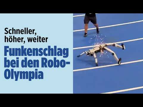 Humanoide Roboter laufen beim zweiten World Humanoid Robot Games auf einer Laufbahn in Peking um die Wette