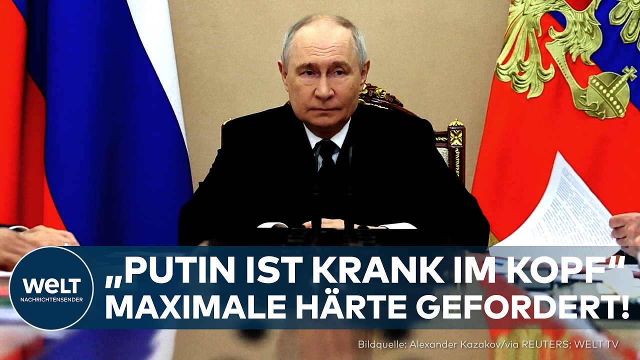 hybrider Krieg – Demonstranten in Deutschland halten Plakate gegen den hybriden Krieg Russlands und fordern härtere Sanktion…