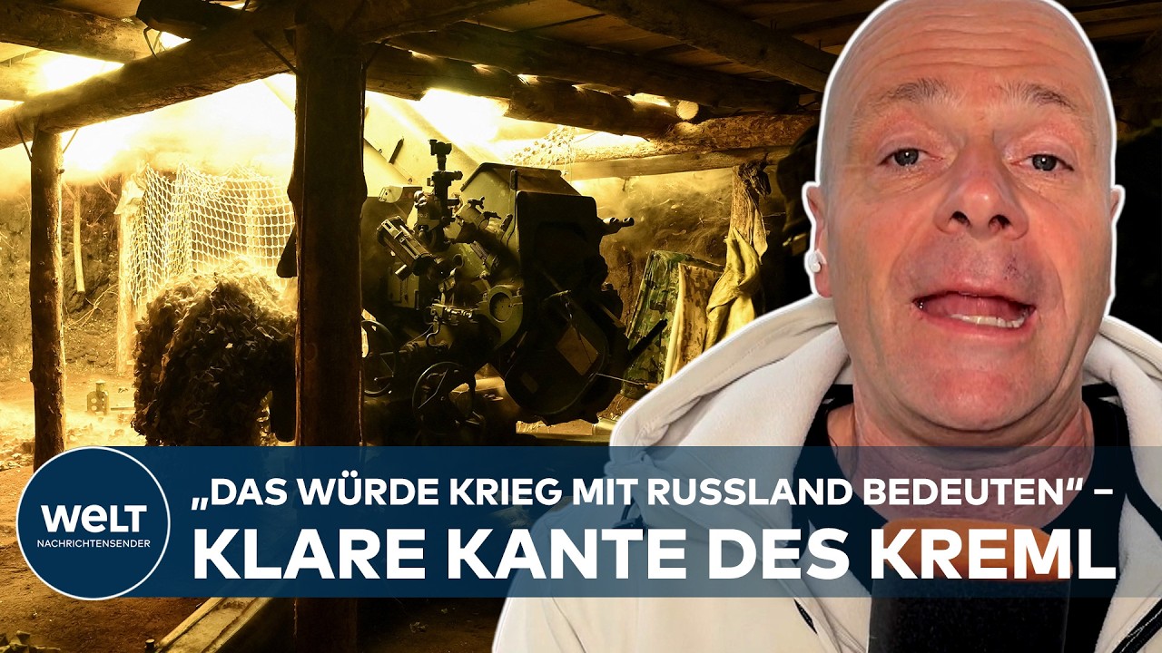 Wladimir Putin bei einer Pressekonferenz mit erhobener Hand – Putin NATO-Drohung im Ukraine-Krieg