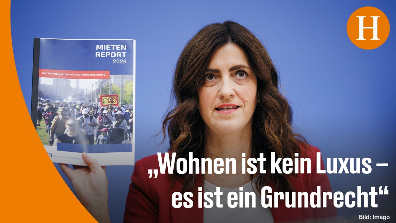 Demonstranten mit Plakaten für einen Mietenstopp vor einem Berliner Mietshaus