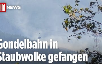 Felssturz Zugspitze – Staubwolke nach Felssturz an der Zugspitze hüllt die Gondelbahn der Bayerischen Zugspitzbahn ein