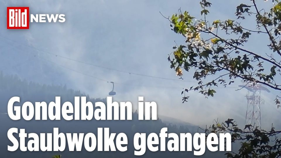 Felssturz Zugspitze – Staubwolke nach Felssturz an der Zugspitze hüllt die Gondelbahn der Bayerischen Zugspitzbahn ein