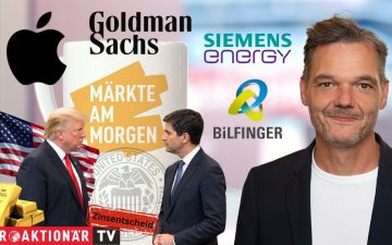Zinserhöhung Fed – Händler an der Wall Street verfolgt auf Bildschirmen die Kursentwicklung nach der Zinserhöhung der Fed