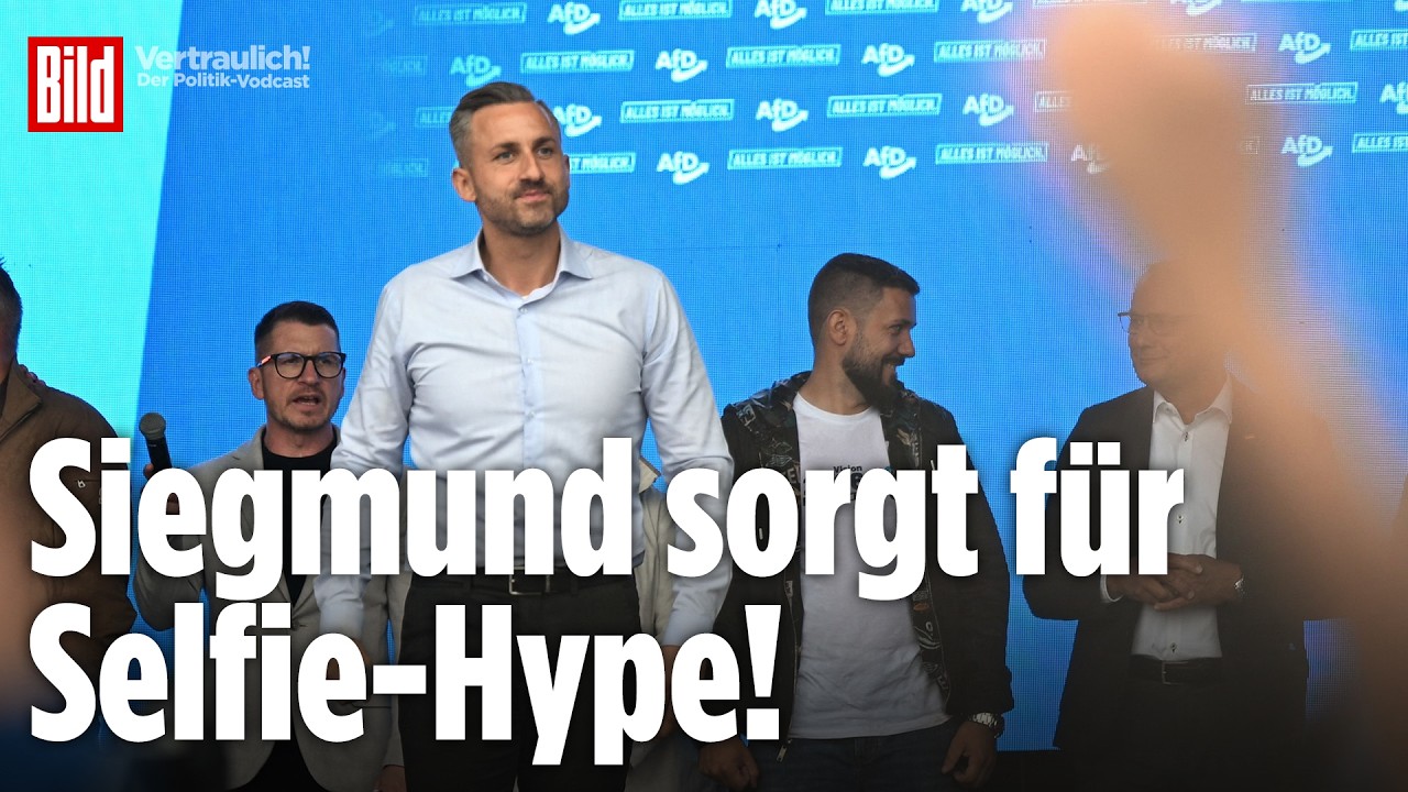 Besucher stehen beim AfD-Familienfest Magdeburg Schlange für ein Selfie mit Ulrich Siegmund vor einem Zelt