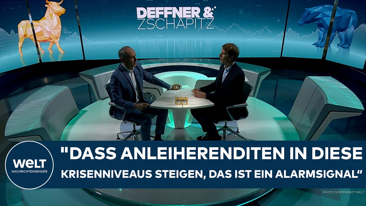 Händler an der Frankfurter Börse verfolgen steigende Anleiherenditen auf digitalen Anzeigetafeln