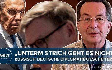 Flaggen der Ukraine und Russlands vor diplomatischem Gebäude – Symbol für Ukraine-Krieg Diplomatie und Verhandlungen