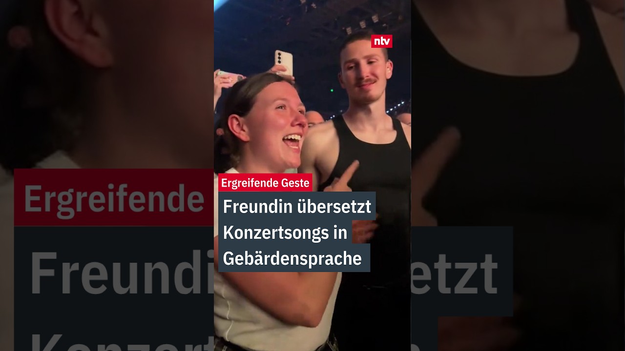 Gebärdensprache Konzert – Frau übersetzt Konzert in Gebärdensprache für ihren gehörlosen Partner im Publikum