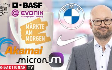 Händler an der Börse verfolgen die Märkte am Morgen mit Blick auf DAX, Akamai und Micron auf digitalen Anzeigetafeln