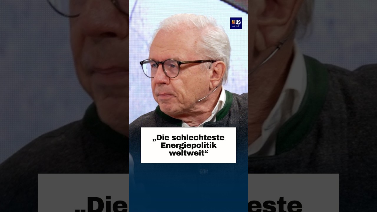 Windräder und Kohlekraftwerk in Deutschland symbolisieren den Konflikt in der Energiewende-Debatte