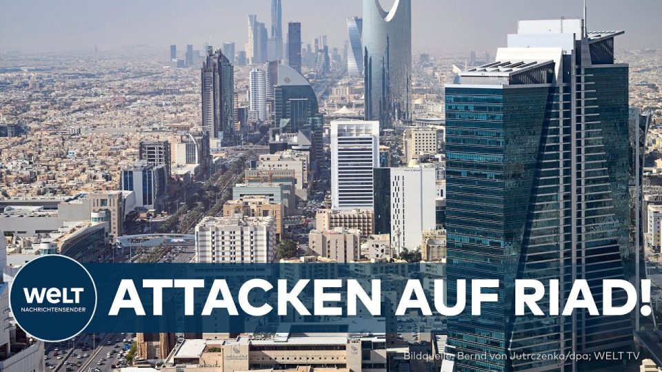 Rauchsäule über einer Stadt nach einem Huthi-Angriff auf Riad, Saudi-Arabien, mit Abwehrraketen am Himmel
