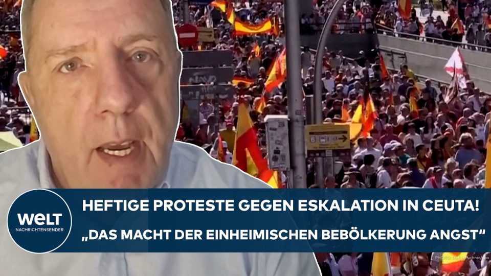 Protestierende in Madrid mit Transparenten gegen die Ceuta Migrationskrise und die Regierung Sánchez