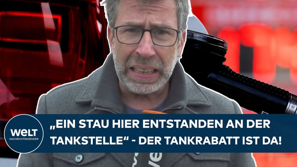 Autofahrer tanken an überfüllter Tankstelle nach Einführung des Tankrabatts – Spritpreisanzeige unter 2 Euro