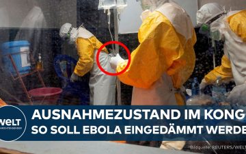 Ebola-Epidemie Kongo – Medizinisches Personal mit Schutzausrüstung vor einem mobilen Ebola-Diagnoselabor im Kongo