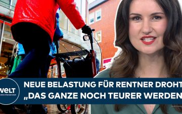 Älteres Ehepaar berechnet Rentner Beiträge für Kranken- und Pflegeversicherung am Küchentisch