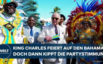 König Charles III. bei einer Straßenparade in Nassau, Bahamas – im Hintergrund die Debatte um Sklaverei-Reparationen