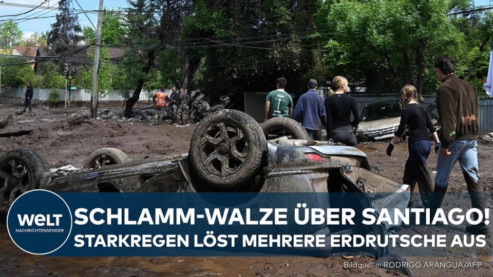 Schlammlawine Santiago – Schlammlawine wälzt sich durch eine Straße in Santiago de Chile nach heftigen Regenfällen