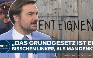 Berliner Mietshäuser mit Schriftzug Vergesellschaftung Berlin – Debatte um Artikel 15 Grundgesetz