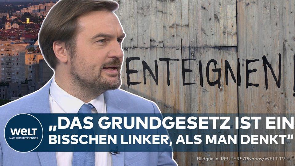Berliner Mietshäuser mit Schriftzug Vergesellschaftung Berlin – Debatte um Artikel 15 Grundgesetz