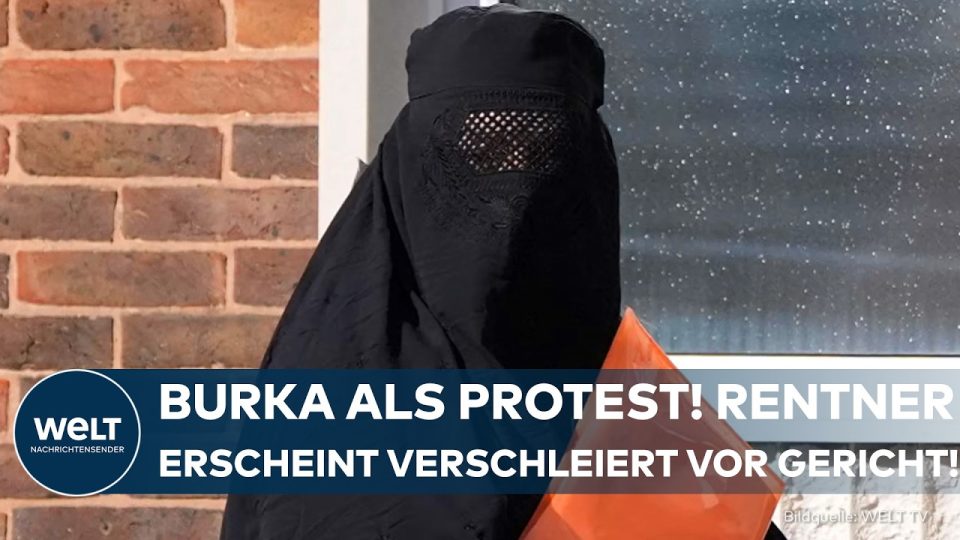 Ein Mann in einer schwarzen Burka steht vor einem britischen Gerichtsgebäude – Burka Gerichtssaal Protest Portsmouth