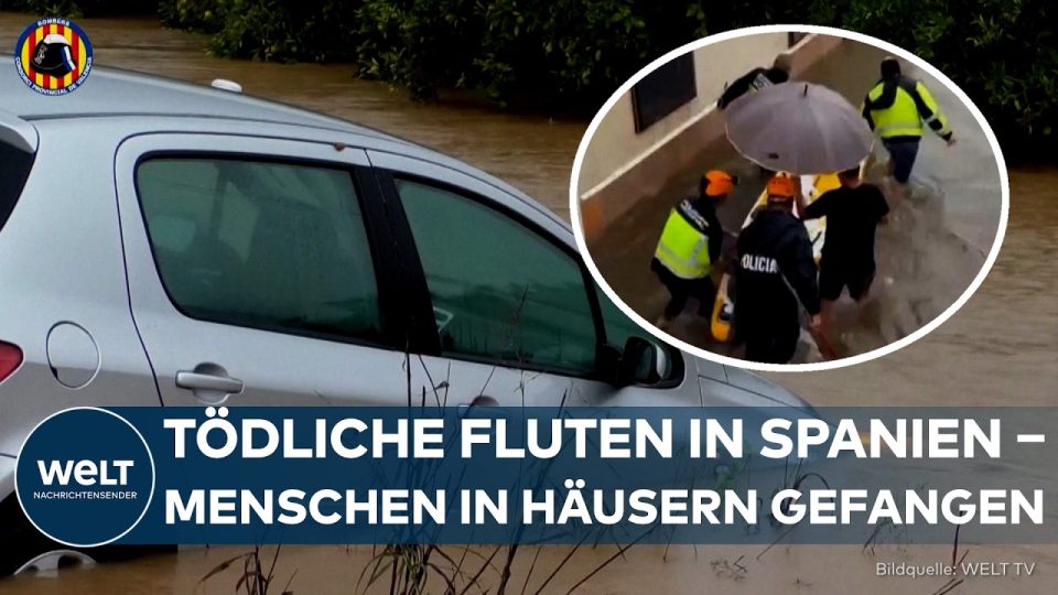 Überflutete Straße in Ostspanien mit mitgerissenen Autos bei schweren Überschwemmungen in Spanien