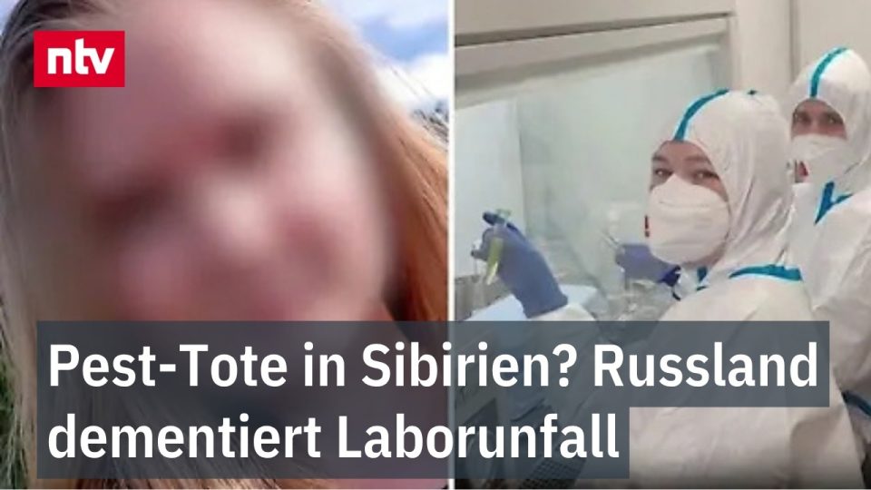 Laborantin in Schutzausrüstung untersucht Proben in einem Hochsicherheitslabor – Lungenpest-Forschung in Sibirien