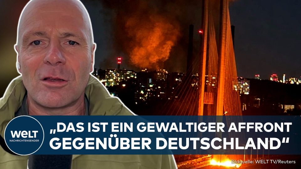 Drohnenangriff Kiew – Bundeskanzler Friedrich Merz in Kiew – im Hintergrund Rauch nach einem Drohnenangriff auf die ukrainis…