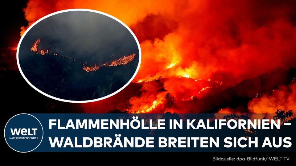 Waldbrand Kalifornien – Feuerwehrleute bekämpfen einen Waldbrand in Kalifornien, Flammen und Rauch über Wohnhäusern nahe San…